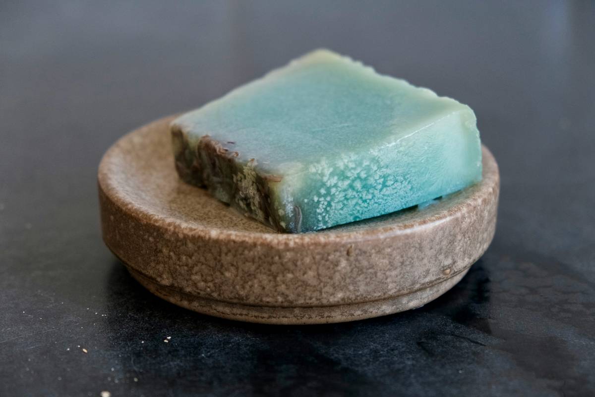 Close-up of rich lather from shaving soaps with moisturizing properties applied to beard area